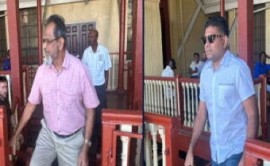 Azruddin Mohamed (right) and his businessman father, Nazar Mohamed, appear in a magistrate’s court on Monday