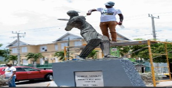 The Jamaica National Heritage Trust (JNHT) carried out cleaning and preservation work on the statue of cricket legend George Headley. Photo: JIS