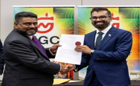 Land and Legal Affairs and Minister in the Ministry of Agriculture and Fisheries, Saddam Hosein (right and NGC chairman Gerald Ramdeen at the ceremony on Friday.