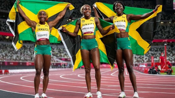 Jamaican sprinter Elaine Thompson-Herah celebrates as she realizes she was blazing into history in the women’s 100-m Olympics finals on July 31, 2021.