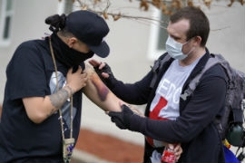 A street medic examines an injured protester. (Courtesy: Nedahness Greene)