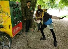 Abdul rules the mic as Edward, left, and Don Pepito admire the show with Iternal’s sound system and wheels in the background.