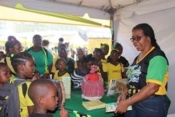 Mrs. Jacqulyn Murry, Library Assistant at the Jamaica Cultural Development Commission (JCDC) discusses the importance of our National Heroes with eager students at the JCDC’s Booth during Let’s Celebrate Jamaica Day 2019, held at the National Arena on Friday, February 22.