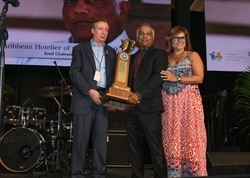 Hotelier Sunil Chatrani (center) receives his award from CHTA's Director General Frank Comito (left) and CHTA President Patricia Affonso-Dass.