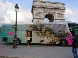 Reggae Girlz mascot Toya boards the Jamaica Tourist Board (JTB) branded fan bus in Paris. The bus made a stop at the Arc de Triomphe de l’Etoile, one of the most famous monuments in Paris before continuing its journey to Reims where the Reggae Girlz play their next match versus Italy on Friday, June 14 at 2: 00 pm Jamaica time (3:00 pm ET)