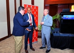 CHTA's CEO Frank Comito (right) and Chief Marketing Officer Matt Cooper (left) talk tourism with David Noel, President & CEO, Scotiabank Group Jamaica during Caribbean Travel Marketplace.