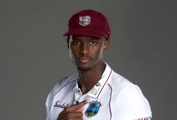 Holder points to Black Lives Matter logo.