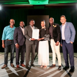 Rev. Dr. Sheila McKeithen, President of the Universal Foundation for Better Living (UFBL) (3rd right) is honoured by the Broward County with a Proclamation declaring July 20 as Rev Dr. Sheila McKeithen Day! Sharing the occasion from left to right: Marlon Hill, Attorney & Candidate for Miami Dade Commissioner District 9; Commissioner Maxwell B. Chambers, Miramar; Dale V.C. Holness, Vice-Mayor & Broward Commissioner; Rev. Dr. McKeithen; Conroy Wilson, Executive Director of Ashe and Oliver Mair, Jamaica’s Consul General to Southeast USA.   
