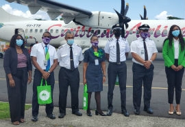 Dominica Minister of Tourism, The Honourable Denise Charles with Caribbean Airlines crew.