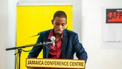 Artist Kimani Beckford addresses the audience at the launch of his first solo exhibition, Affirmation, held at the Jamaica Conference Centre in Kingston on Sunday, March 24.