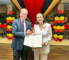 Karolin Troubetzkoy receives the Order of Merit from His Excellency Holger Michael, Ambassador of the Federal Republic of Germany to the Caribbean.