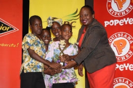 Students from Faith Builders Early Childhood Centre show off their award at the Traditional Folk Form National Finals 2019 at Little Theatre in Kingston.