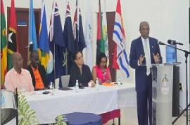 Health and Environment Minister Sir Molwyn Joseph addressing the OECS Environment Exhibition launch at UWI FIC