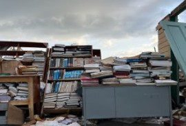 School books left in the open after Hurricane Melissa destroyed a school in Jamaica