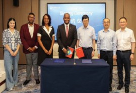 Health Minister, Michael Joseph, (center) with Chinese officials after signing various agreements