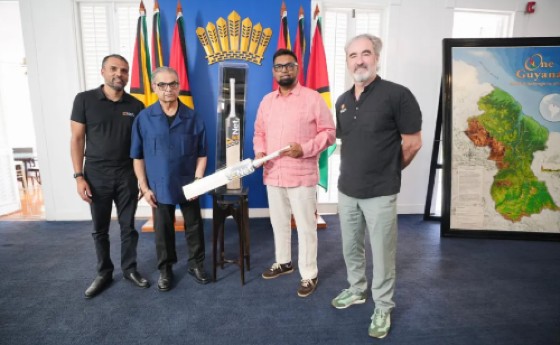President Dr Mohamed Irfaan Ali (second right) is flanked by Director of the ExxonMobil Guyana Global Super League, Jamie Stewart (left) and Chief executive officer of E-Networks, Vishok Persaud, along with Rakesh Puri (right).