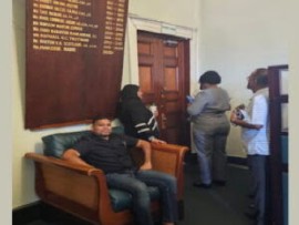WIN leader, Azruddin Mohamed, sitting outside the office of the Speaker, Manzoor Nadir, hoping for a meeting with regards to the election of an opposition leader in Guyana.
