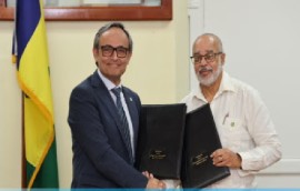 Director General of the Organisation of Eastern Caribbean States (OECS), Dr Didacus Jules (right) and World Pediatrics chief executive officer, Vafa Akhavan, after signing the MoU.