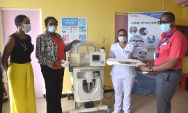 Specialist Nurse at the LTH, Vasantie Dubrey (2nd right) accepts the donation from President of Medical Strategies AO Limited, Dr. Roger  Hunter, while Head of Paediatrics at the LTH, Dr. Tamara McKenzie (left) and CEO for the facility, Nadine Preddie look on. The occasion was the handing over of paediatrics equipment to the hospital by Medical Strategies AO Limited, valued at $2 million.