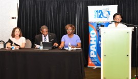 Prime Minister Dr. terrance Drew flanked by PAHO/WHO’s Amalia Del Riego, and Permanent Secretary (Ag) in the Ministry of Health, Dr. Sharon Archibald.