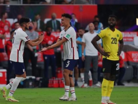 Ricardo Pepi (left) celebrates with teammate Antonee Robinson (center) to the bewilderment of Jamaican defender Kemar Lawrence. (USMNT photo)