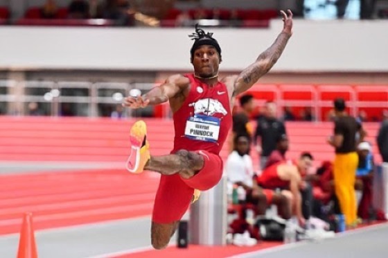 Wayne Pinnock leaps during the men’s long jump competition of the NCAA indoor track & field championships on Friday in the American city of Boston. (Photo by Sadie Rucker/Arkansas Athletics)