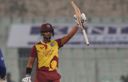 Left-hander Nicholas Pooran celebrates his half-century on Wednesday. (Photo courtesy BCCI)