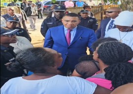 Prime Minister Andrew Holness meeting with relatives and family members of those killed on Sunday night