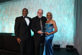 Photo caption: Ken Shapiro (center), Senior Vice President and Content Director, TravelAge West, presents Dian Holland, District Sales Manager, West/Southwest USA at the Jamaica Tourist Board and her colleague Ray Lee, Business Development Officer for the Western U.S. with the award for International Tourism Board Providing the Best Travel Advisor Support at the recent TravelAge West WAVE Awards, held at The Ritz-Carlton, Marina del Rey, California.
