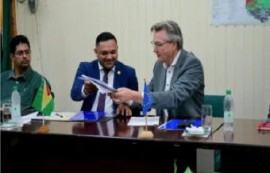 Minister of Natural Resources, Vickram Bharrat and Ambassador of the European Union to Guyana, Rene Van Nes at the signing