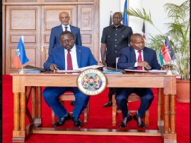 Prime Minister Dr. Ariel Henry of Haiti and President William Ruto witness the signing of the reciprocal agreement allowing for troops from Kenya to be deployed in Haiti