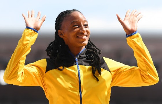 Barbadian Sada Williams celebrates on the podium after winning 400 metres gold on Sunday.