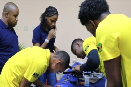 Jamaican and Barbadian participants collaborate during a drone training exercise at the Studica Robotics Training Camp, gaining valuable experience ahead of WorldSkills Shanghai 2026. (A. Reid|BGIS)