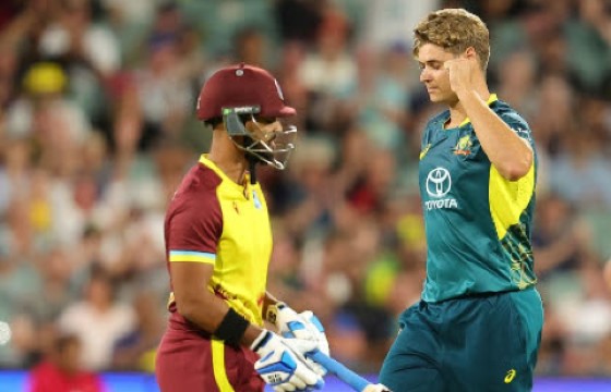 Top order batsman Nicholas Pooran walks off after being dismissed by left-arm seamer Spencer Johnson.