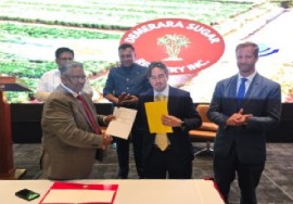 SUCRO’s Vice President and Head Trader, Oliver Hire (middle) and Demerara Sugar Refinery Inc;’s (DSR) director, Komal Singh(left) at the signing ceremony