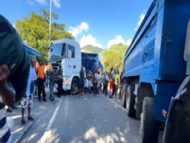 Truckers used their vehicles to block one of the main highways leading into and out of the capital, Roseau, on Wednesday (CMC Photo)