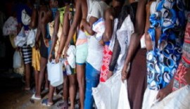Residents of Cité Soleil in Haiti queue for UN relief items (UN Photo)