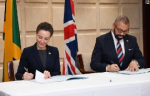 Minister of Foreign Affairs and Foreign Trade, Senator the Hon. Kamina Johnson Smith (left) and Secretary of State for Foreign, Commonwealth and Development Affairs of the United Kingdom, the Rt. Hon. James Cleverly, sign a framework document for a £15-million ($2.9-billion) violence-prevention project, during a press conference following a JA-UK strategic dialogue at the Ministry’s downtown Kingston offices on May 19. (Photo courtesy of RUDRANATH FRASER of JIS)